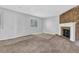 A living room with a brick fireplace and carpet floors at 5338 Timor Trl, Lithonia, GA 30038