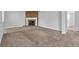 A living room with a brick fireplace and carpet floors at 5338 Timor Trl, Lithonia, GA 30038