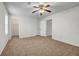 Bedroom with carpet flooring, ceiling fan, and a closet in a cozy setting at 114 Belmonte Sw Dr, Atlanta, GA 30311