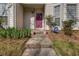 Charming entryway with a vibrant purple door and stone steps leading to a cozy home at 114 Belmonte Sw Dr, Atlanta, GA 30311