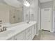 Bathroom featuring double vanity, large mirror, and white cabinets at 2124 Silas Nw Way, Atlanta, GA 30318