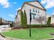 Landscaped community street view featuring sidewalks, manicured lawns, and tasteful landscaping at 2124 Silas Nw Way, Atlanta, GA 30318