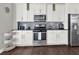 Well-equipped kitchen with stainless steel appliances, and white cabinets at 2124 Silas Nw Way, Atlanta, GA 30318