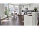 Sun-filled kitchen with hardwood floors, island and stainless steel appliances at 2124 Silas Nw Way, Atlanta, GA 30318