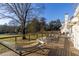 Relaxing back deck featuring a hammock, seating, and scenic views of the lawn and surrounding trees at 770 Winding Creek Trl, Dacula, GA 30019