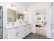 Modern bathroom with double sinks, sleek fixtures, and stylish decor and bedroom view at 770 Winding Creek Trl, Dacula, GA 30019