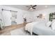 Light and airy bedroom with barn door to bath, neutral tones, and lots of light at 770 Winding Creek Trl, Dacula, GA 30019