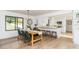 Bright dining room with a view of the kitchen and backyard at 770 Winding Creek Trl, Dacula, GA 30019