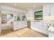 Well-lit kitchen featuring stainless steel appliances, an island, and an open view of the dining area at 770 Winding Creek Trl, Dacula, GA 30019