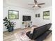 A modern living room that has neutral paint, wood floors, and natural light at 770 Winding Creek Trl, Dacula, GA 30019