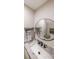 Bathroom boasts a round mirror, sleek sink and marble countertop at 1261 Lavista Ne Rd # B3, Atlanta, GA 30324