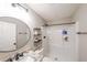 Modern bathroom with marble counter tops, a round mirror and a shower stall at 1261 Lavista Ne Rd # B3, Atlanta, GA 30324