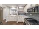 Modern kitchen featuring white cabinets, marble countertops, and herringbone backsplash at 1261 Lavista Ne Rd # B3, Atlanta, GA 30324