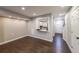 Open-concept living area with pass-through window to the renovated kitchen, recessed lighting and luxury vinyl floors at 1261 Lavista Ne Rd # B3, Atlanta, GA 30324