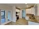 Well-lit kitchen with white cabinets, granite countertops, and stainless steel appliances at 50 Senator Lake Dr, Douglasville, GA 30134