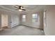 Spacious main bedroom features a ceiling fan, carpet, and great natural lighting at 50 Senator Lake Dr, Douglasville, GA 30134