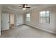 Large main bedroom featuring tray ceiling, carpet floors, and ample natural light at 50 Senator Lake Dr, Douglasville, GA 30134