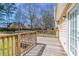 Wood deck with railing overlooking the backyard, providing a great outdoor living space at 774 Marthas Dr, Lawrenceville, GA 30045