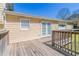 Wood deck off the back of the house with access through glass doors and wooden railings at 774 Marthas Dr, Lawrenceville, GA 30045