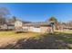 Backyard view of house featuring a shed, deck, patio, and attached garage at 774 Marthas Dr, Lawrenceville, GA 30045