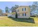 Inviting exterior view of a well-maintained two-story home with a grassy lawn and attached garage at 774 Marthas Dr, Lawrenceville, GA 30045