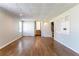 Spacious living room with hardwood floors, built-in shelving and staircase at 774 Marthas Dr, Lawrenceville, GA 30045