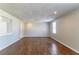 Living room with hardwood floors, natural light, and neutral walls at 774 Marthas Dr, Lawrenceville, GA 30045