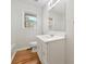 Bathroom with white vanity and a large mirror and natural light at 2664 Homeland Dr, Atlanta, GA 30360