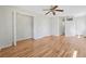 Spacious bedroom with hardwood floors, neutral paint, and bi-fold closet at 2664 Homeland Dr, Atlanta, GA 30360