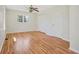 Bedroom featuring hardwood floors, a ceiling fan, and a double closet at 2664 Homeland Dr, Atlanta, GA 30360
