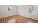 Bedroom with hardwood floors, natural light from two windows at 2664 Homeland Dr, Atlanta, GA 30360