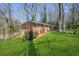 Well-maintained brick home with a beautiful lawn and mature trees at 2664 Homeland Dr, Atlanta, GA 30360