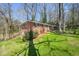 Well-maintained brick home with a beautiful lawn and mature trees at 2664 Homeland Dr, Atlanta, GA 30360