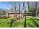 Charming brick home with a covered carport and a lush green lawn at 2664 Homeland Dr, Atlanta, GA 30360