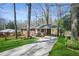 Charming brick home featuring a carport and well-maintained front yard at 2664 Homeland Dr, Atlanta, GA 30360
