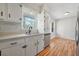 Bright kitchen with white cabinets, stainless steel appliances, and hardwood floors at 2664 Homeland Dr, Atlanta, GA 30360