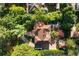 Stunning aerial perspective of lush landscaping, outdoor entertainment, and red tiled roof at 401 Peachtree Battle Nw Ave, Atlanta, GA 30305