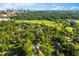 Aerial view of a home situated near a lush golf course and a cityscape skyline at 401 Peachtree Battle Nw Ave, Atlanta, GA 30305