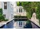 Swimming pool reflecting the classic elegance of the home's exterior at 401 Peachtree Battle Nw Ave, Atlanta, GA 30305