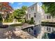 Beautiful backyard reflecting pool and lush landscaping creating a serene outdoor oasis at 401 Peachtree Battle Nw Ave, Atlanta, GA 30305