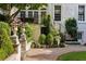 Elegant backyard features professionally landscaped terrace with brick, stone and greenery at 401 Peachtree Battle Nw Ave, Atlanta, GA 30305
