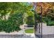 Charming backyard iron gate is draped with vines and climbing ivy at 401 Peachtree Battle Nw Ave, Atlanta, GA 30305