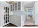 Bathroom with storage cabinets and drawers plus a view through to the bath and vanity at 401 Peachtree Battle Nw Ave, Atlanta, GA 30305