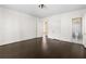 Bedroom featuring dark hardwood floors, neutral walls, and doorway to bath at 401 Peachtree Battle Nw Ave, Atlanta, GA 30305