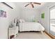 Bright bedroom with white walls and a ceiling fan, offering a calm and inviting space at 401 Peachtree Battle Nw Ave, Atlanta, GA 30305
