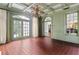 Charming bonus room featuring a unique coffered ceiling, brick floors, and a view into the yard at 401 Peachtree Battle Nw Ave, Atlanta, GA 30305