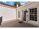 A charming outdoor deck with a white textured wall, windows, and door, perfect for relaxing at 401 Peachtree Battle Nw Ave, Atlanta, GA 30305