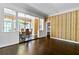 Dining room with rich wallpaper, hardwood floors, and natural light from the windows at 401 Peachtree Battle Nw Ave, Atlanta, GA 30305