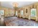 Formal dining room featuring decorative walls, ornate chandelier, and large windows at 401 Peachtree Battle Nw Ave, Atlanta, GA 30305