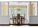Dining room with hardwood floors, decorative wainscoting, and elegant chandelier at 401 Peachtree Battle Nw Ave, Atlanta, GA 30305